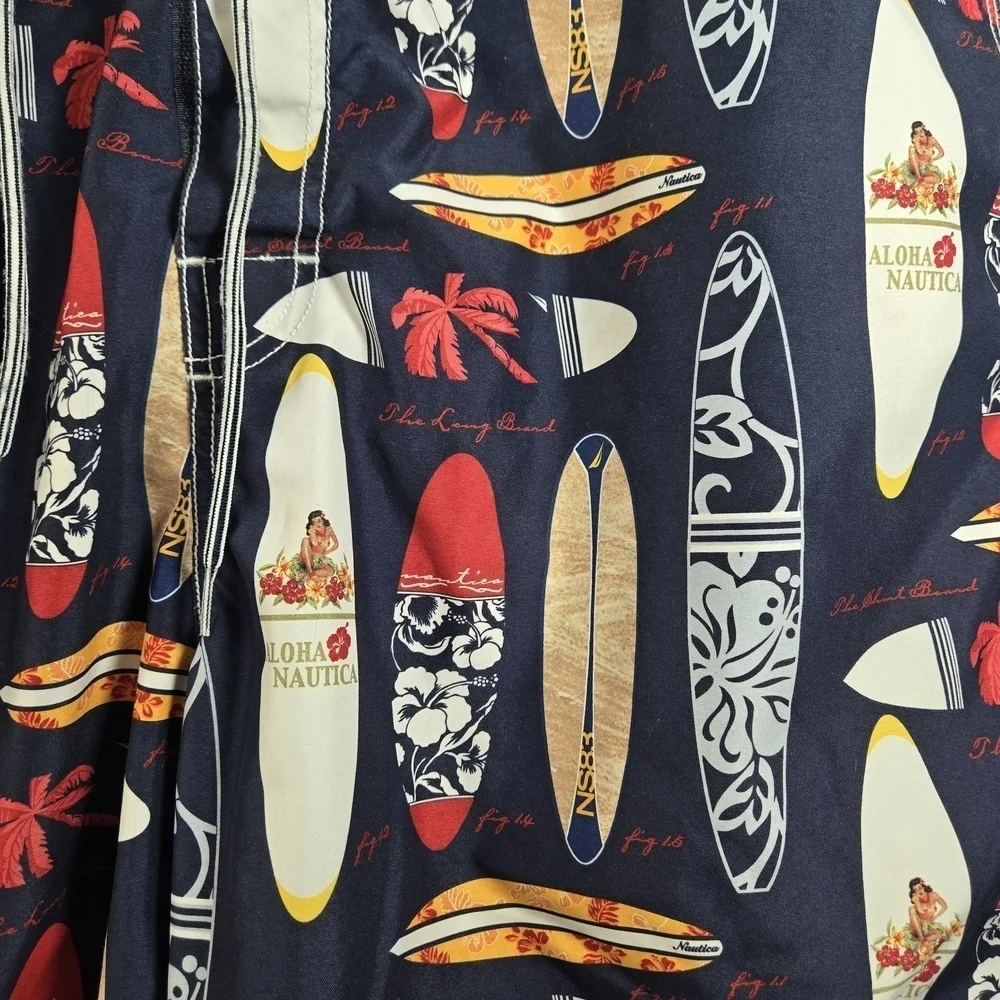 Nautica Blue and Red Swim Trunks with Surfboard Design